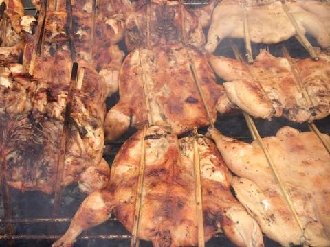 Grilled chicken cooked on bbq grid Stock Photos