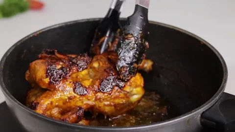 Grilled Chicken frying in pan in kitchen room Video stock 286784206