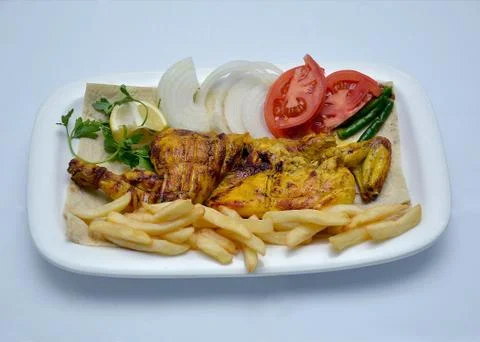 Grilled chicken half portion Foto stock