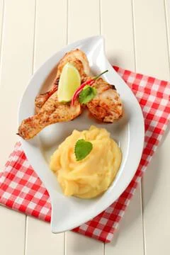 Grilled chicken with lemon and mashed potatoes Stock Photos