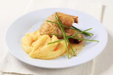 Grilled chicken with mashed potatoes and chives Stock Photos