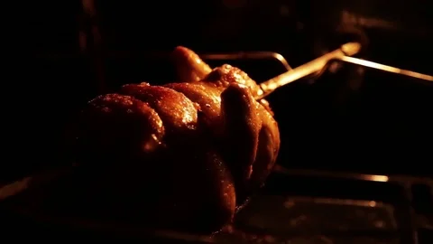 Grilled chicken in the oven on a spit Stock Footage 80923010