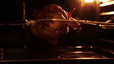 Grilled chicken in the oven on a spit Stock Footage 80923138