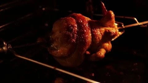 Grilled chicken in the oven on a spit Stock Footage 80923142