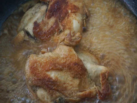 Grilled chicken in pan Stock Footage 74513523