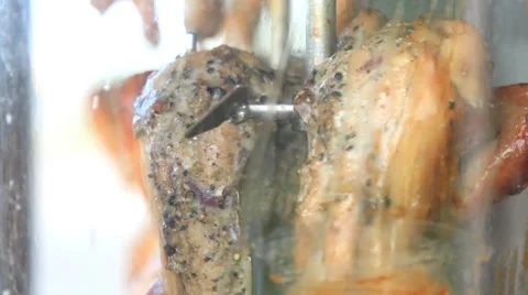 Grilled Chicken rotating on a skewer. Stock Footage 39476541