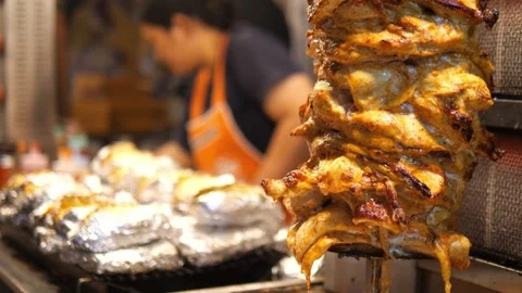 Grilled Chicken Shawarma Rotating on Spit at Street Food . Stock Footage 322007192