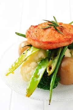 Grilled chicken with vegetables on plate Stock Photos