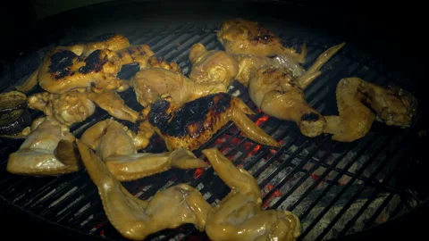 Grilled chicken wings on the grill. Preparing chicken wings on the grill. Stock Footage 159288344