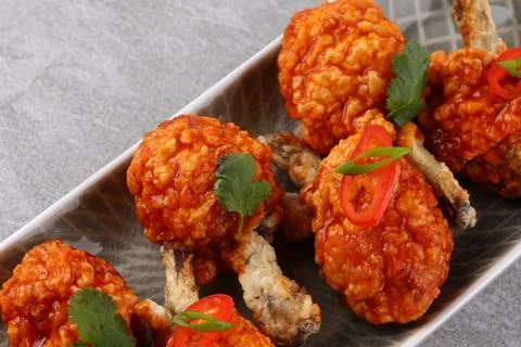 Grilled chicken wings with vegetable and spices flat lay on white background Stock Photos