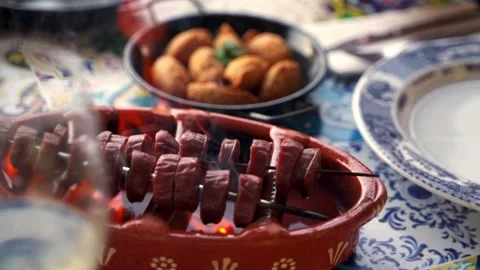 Grilled chorizo, tremocos and cod pasties in a Traditional Portuguese Restaurant Stock Footage 131774457
