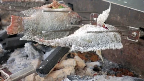Grilled Cichlidae fish with salt. Stock Footage 77895366