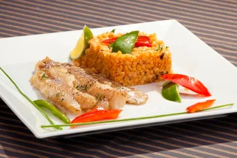 Grilled codfish with red lentil Stock Photos