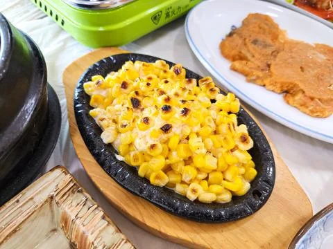 Grilled Corn with Butter Stock Photos