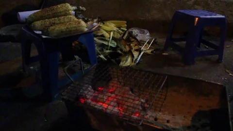Grilled corn on the charcoal stove Stock Footage 78171084