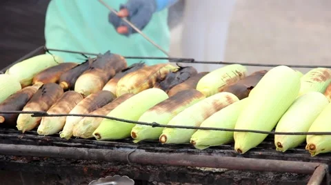Grilled Corn with hand Stock Footage 64297961