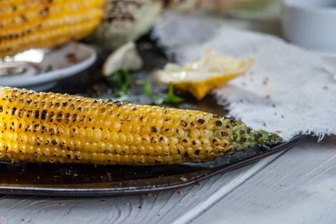 Grilled corn on with lemon, herbs and spices Stock Photos