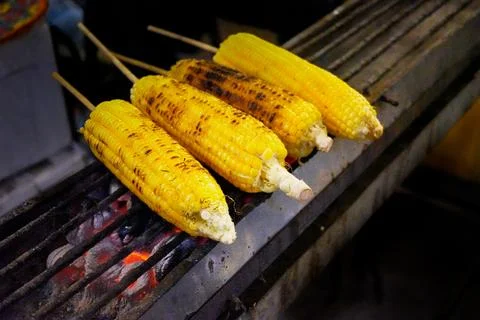 Grilled corn, the process of making grilled corn Stock Photos