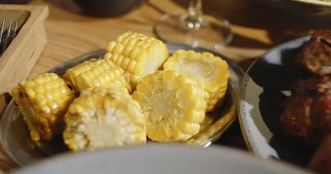 Grilled corn served in the restaurant Stock Footage 320469689