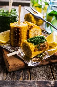 Grilled corn on sticks Stock Photos