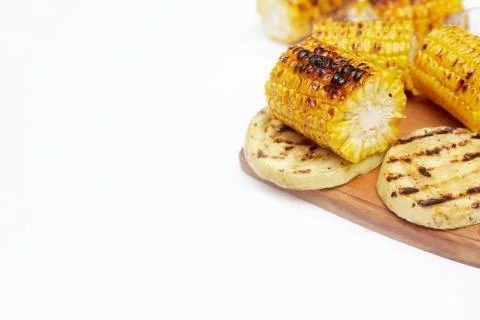 Grilled corn vegetables on a white background, copy space, flatlay Stock Photos