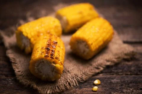 Grilled corn on wooden table Stock Photos