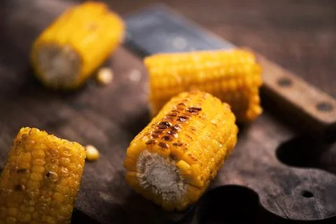 Grilled corn on wooden table Stock Photos
