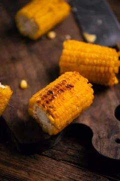 Grilled corn on wooden table Stock Photos