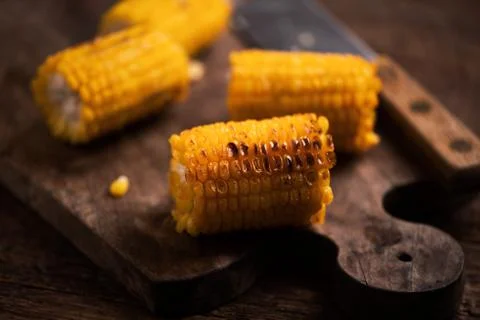 Grilled corn on wooden table Stock Photos