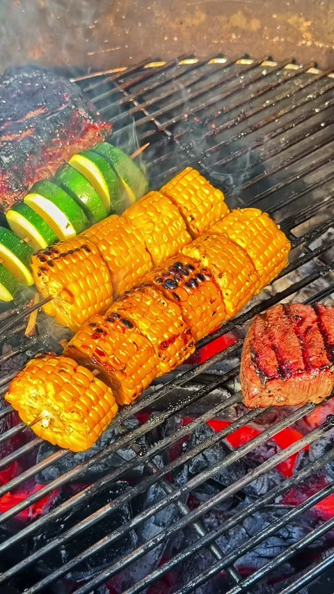 Grilled Corn Zucchini and Meat Cooking Over Charcoal Barbecue Stock Footage 337386145