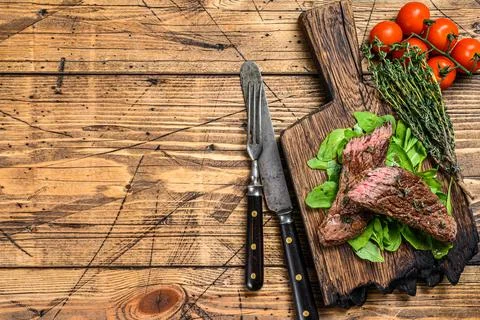 Grilled Cut Skirt machete meat beef Steak on a cutting board. wooden background Stock Photos