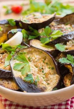 Grilled eggplant on rustic table Stock Photos