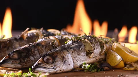 Grilled fish and various vegetables in iron plate Видео 146204826