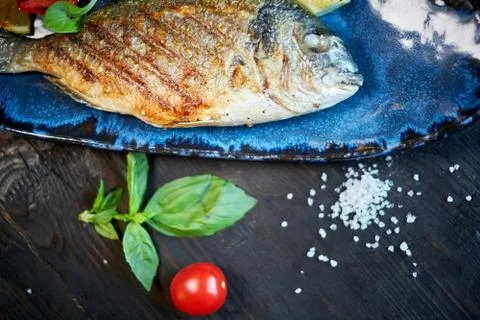 Grilled Fish dish - roasted fish and vegetables jpg Stock Photos