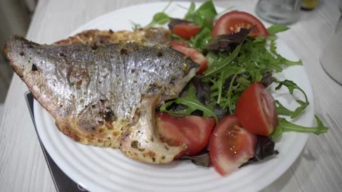 Grilled fish dorado with vegetables Stock Footage 232131387