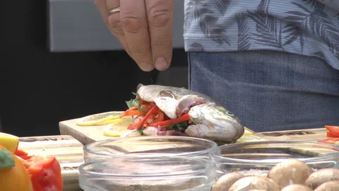 Grilled Fish on the fire. Preparing fish food Stock Footage 114578342