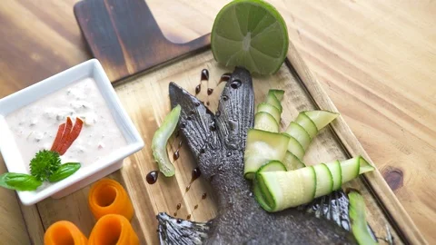 Grilled fish with fresh vegetable and seasoning on wooden table background. Food Stock Footage 104564769