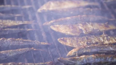 Grilled fish on the grill with steam. Stock Footage
