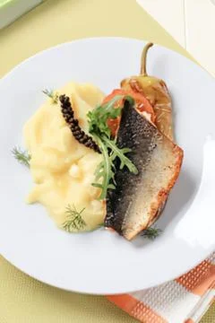 Grilled fish with mashed potatoes and caviar Stock Photos