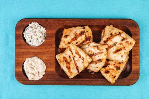 Grilled fish pieces with white and brown rice Stock Photos