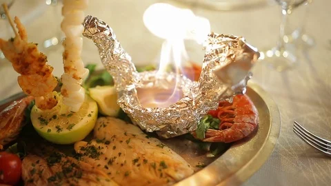 Grilled fish plate with burning fire Stock Footage 88439560