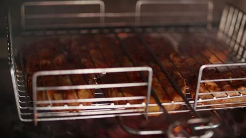 Grilled fish steak sturgeon, coals smoldering in the grill Stock Footage 228616640