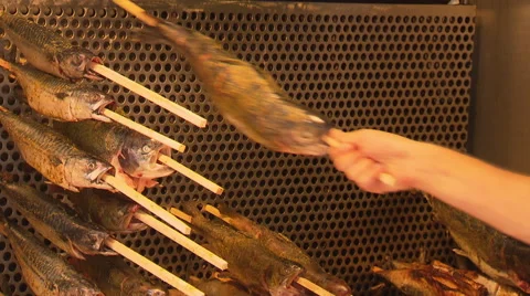 Grilled fish on a stick Stock Footage 57109519