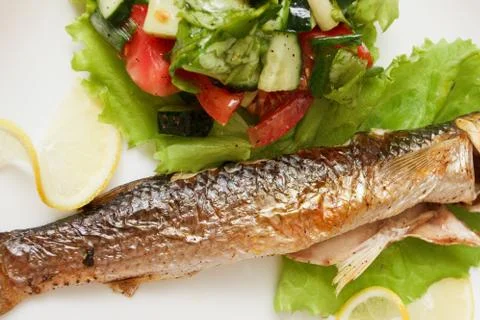 Grilled fish with vegetables Stock Photos
