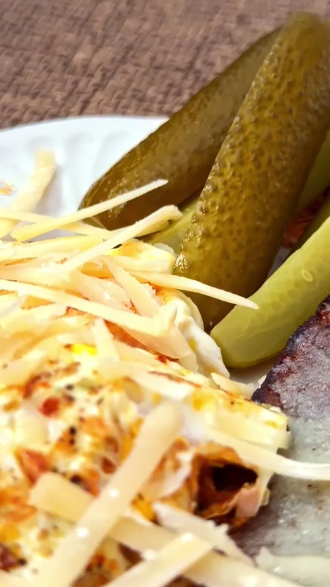 Grilled Flatbread With Melted Cheese and Pickled Cucumbers Close Up, Latvia Stock Footage 336994024