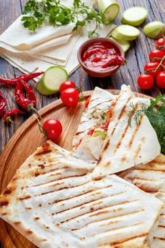 Grilled flatbread stuffed with veggies and cheese Stock Photos