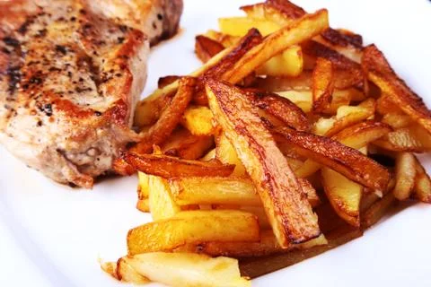Grilled free-range beef steak with potato free, fresh tomatoes and sauce on a Stock Photos