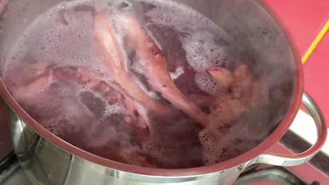 Grilled giant squid tentacles served with lemon and herbs as a gourmet seafood Stock Footage 345172706