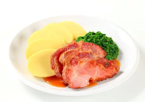 Grilled ham slices with mashed potatoes and broccoli Stock Photos