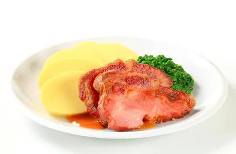 Grilled ham steak with mashed potatoes and broccoli Stock Photos